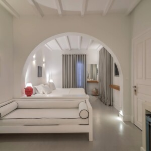 Interior view of Zoe's Club seaview luxury suites in Spetses showing the desk and armchair corner