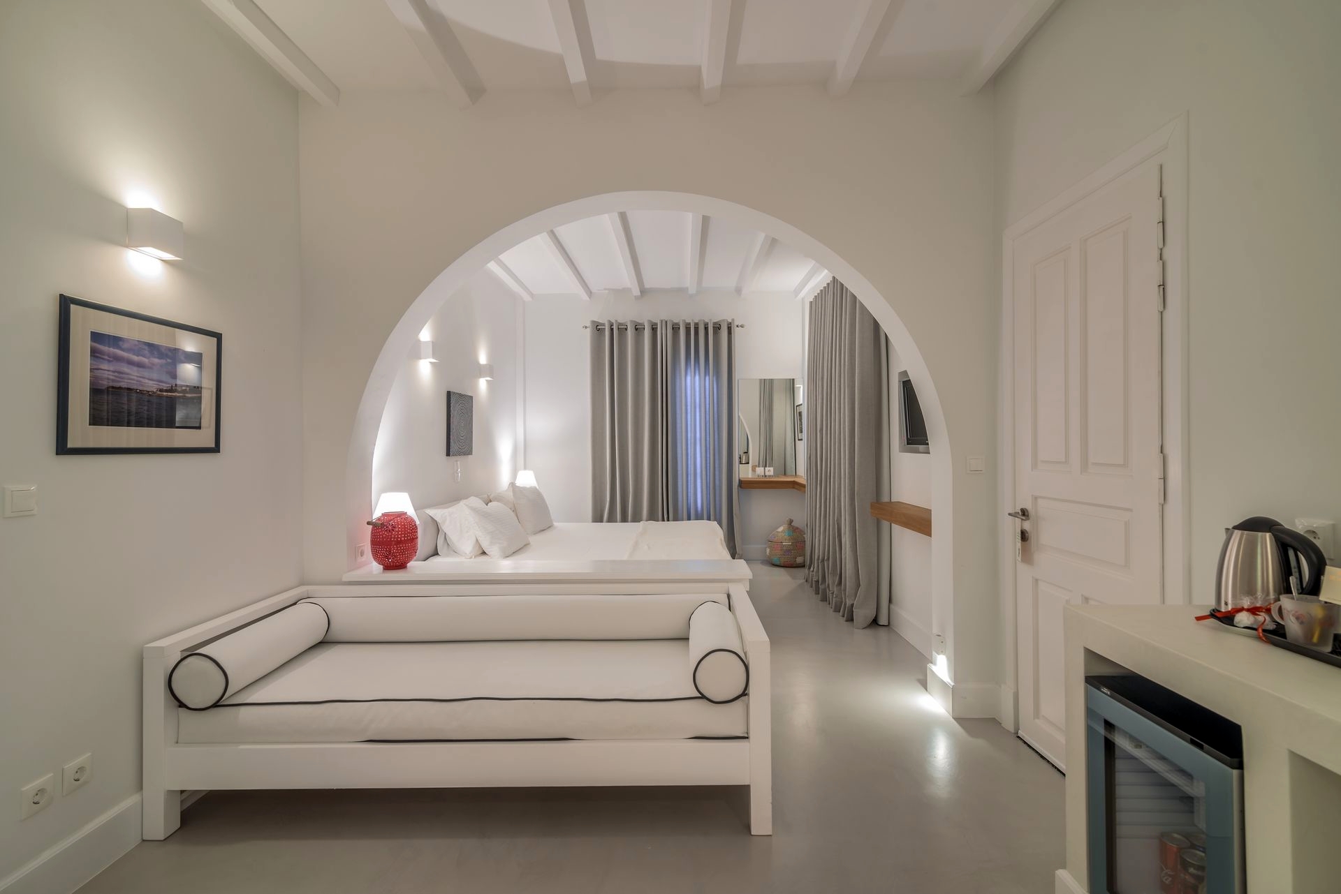 Interior view of Zoe's Club seaview luxury suites in Spetses showing the desk and armchair corner