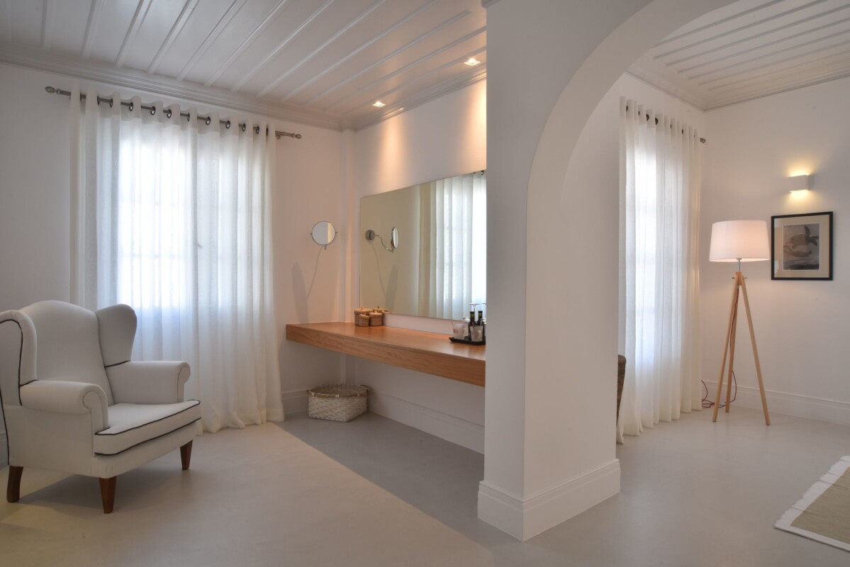Interior view of Zoe's Club seaview luxury suites in Spetses showing the desk and armchair corner