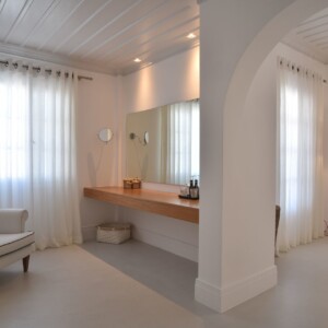 Interior view of Zoe's Club seaview luxury suites in Spetses showing the desk and armchair corner